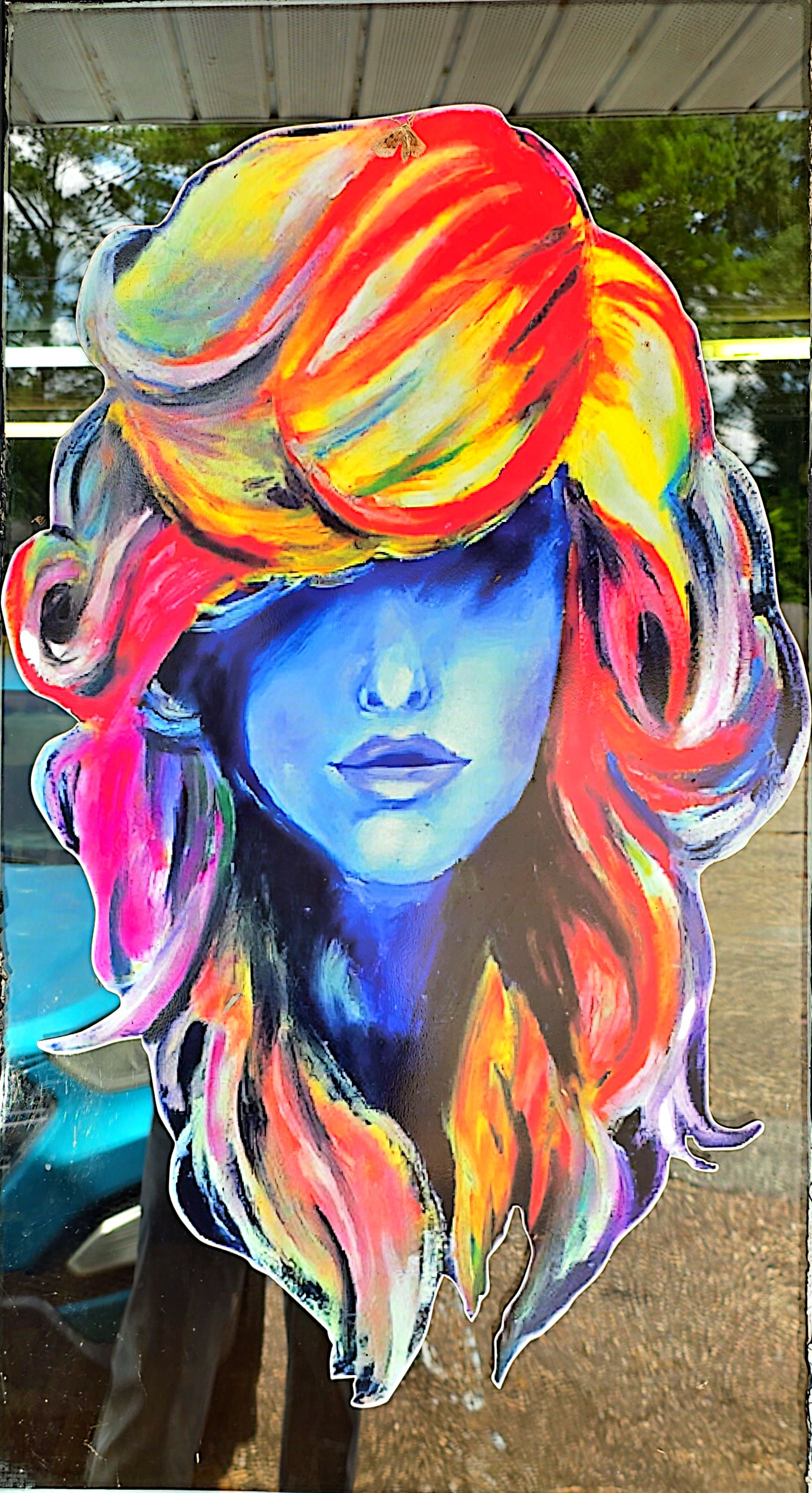 Colorful salon door art of a woman with big hair at Sweet T's Hair Studio